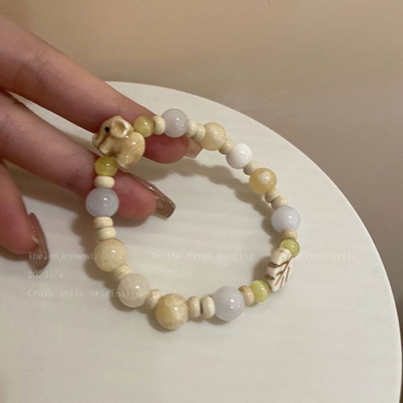 Damen Armband aus handgefertigten Natursteinen mit charmanten Tiermotiven Shop Nory