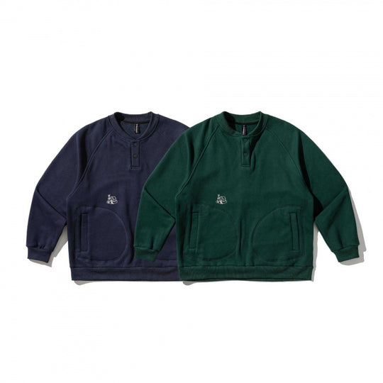 Unisex Oversize-Sweatshirt mit Henley-Knopfleiste, Raglanärmeln und runden Eingrifftaschen Shop Nory
