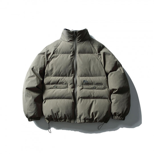 Unisex Boxy wattierte Stehkragen‑Pufferjacke mit Tunnelzugsaum und Pattentaschen Shop Nory