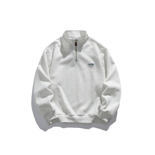 Unisex Halbzip-Sweatshirt mit Stehkragen, Raglanärmeln und minimalistischer Brustpatch Shop Nory