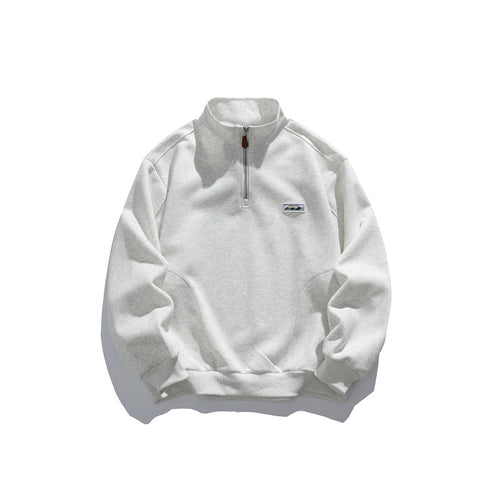 Unisex Halbzip-Sweatshirt mit Stehkragen, Raglanärmeln und minimalistischer Brustpatch Shop Nory
