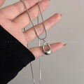 Damen Halskette mit modernem, geschwungenem Anhänger aus hochwertigem Edelstahl Shop Nory
