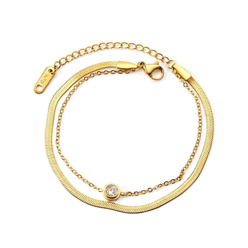 Damen Edelstahl Armband mit funkelndem Zirkonia und goldplattiertem Design Shop Nory