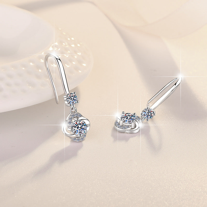 Damenohrringe mit funkelndem Zirkonia und elegantem Wellen-Design Shop Nory