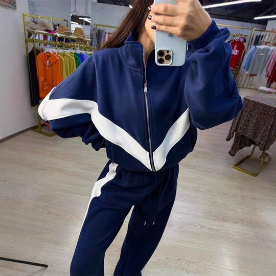 Damen eleganter sportlicher Zweiteiler Trainingsanzug mit Reißverschluss und kontrastierender V-Passe Shop Nory