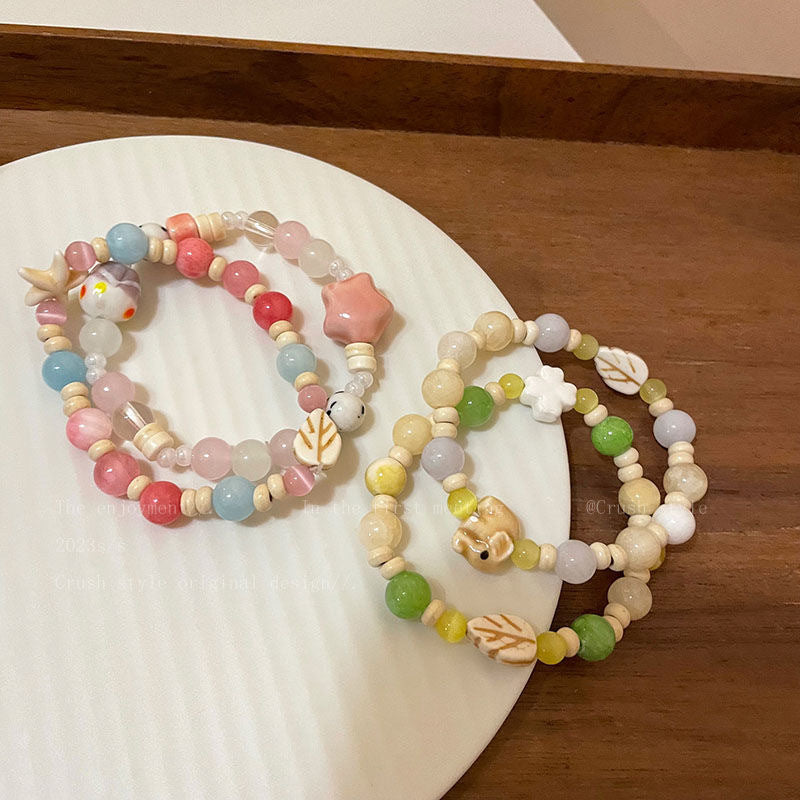 Damen Armband aus handgefertigten Natursteinen mit charmanten Tiermotiven Shop Nory