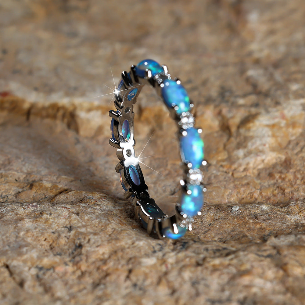 Damen Ring mit funkelnden Opalsteinen und filigranem Design Shop Nory