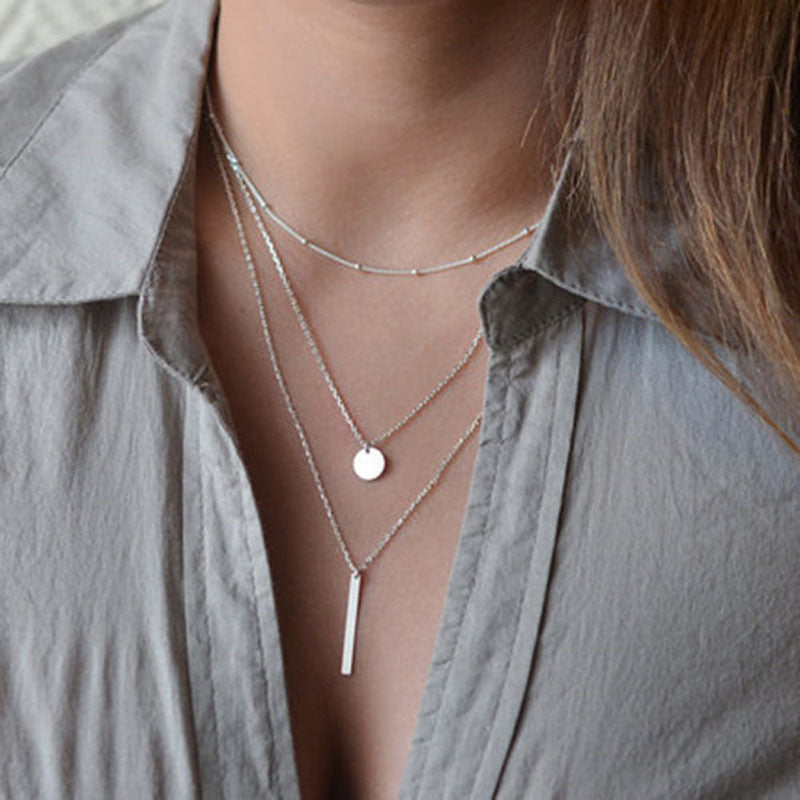 Damen mehrlagige Halskette mit minimalistischen Anhängern und eleganten Details Shop Nory