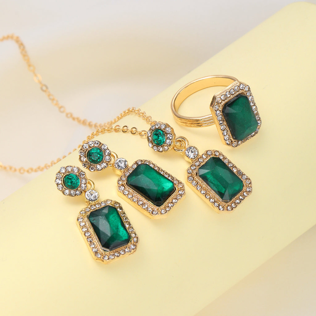 Damen Schmuckset mit funkelnden Smaragd und goldenen Akzenten Shop Nory