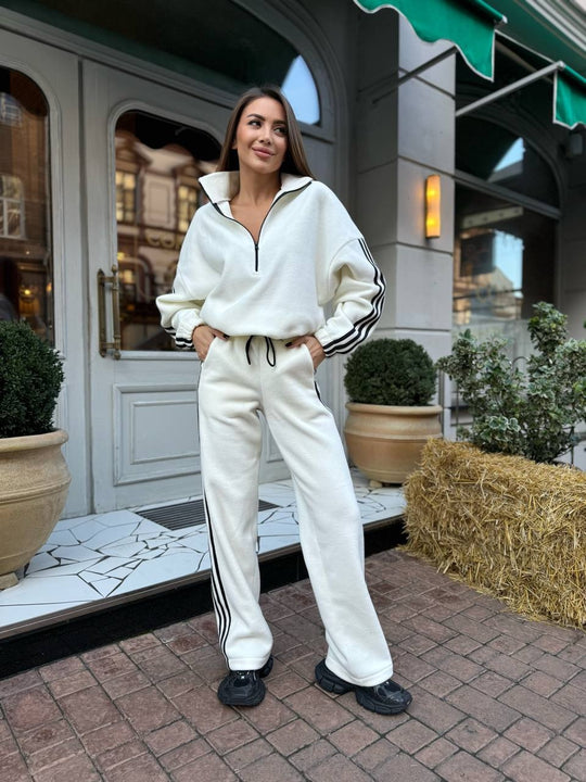 Damen lässiger Highneck-Halbzip Trainingsanzug mit markanten Seitenstreifen, überschnittener Kapuze und weiter Joggerhose Shop Nory