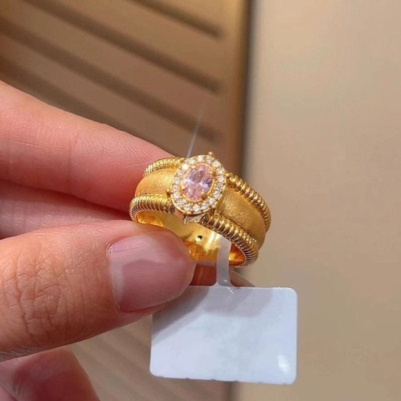 Damenring mit blauem Edelstein und kunstvollem Golddesign Shop Nory
