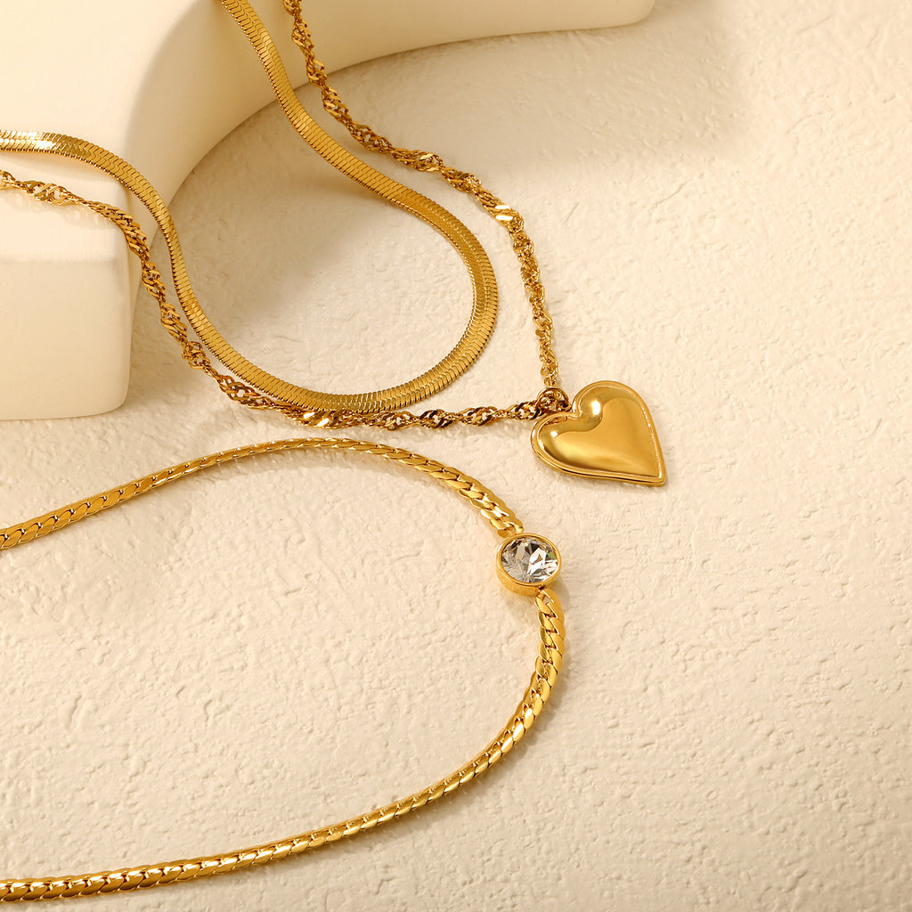 Damen Halskette mit mehrlagigem Herzanhänger und eleganter Gliederkette Shop Nory
