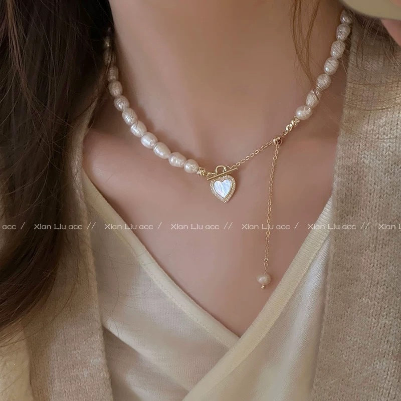 Damen Halskette mit elegantem Perlenanhänger und charmanten Herzdetails Shop Nory