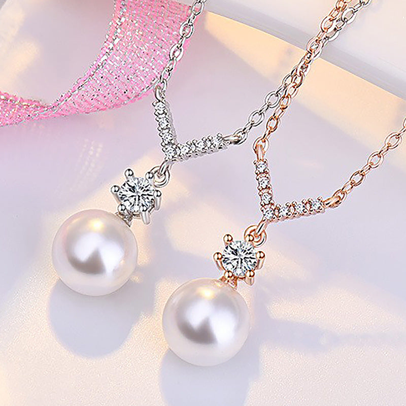 Damen Halskette mit funkelndem Zirkonia-Anhänger und eleganter Perle Shop Nory