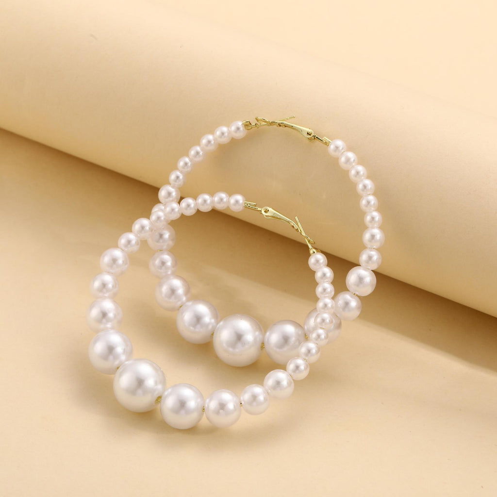 Damen Creolen-Ohrringe mit eleganten Perlen und stilvollem Golddetail Shop Nory