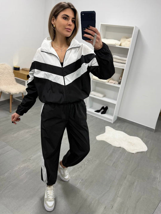 Damen retro Nylon-Trainingsanzug mit Kapuzen-Zipjacke und weiter hochgeschnittener Hose Shop Nory