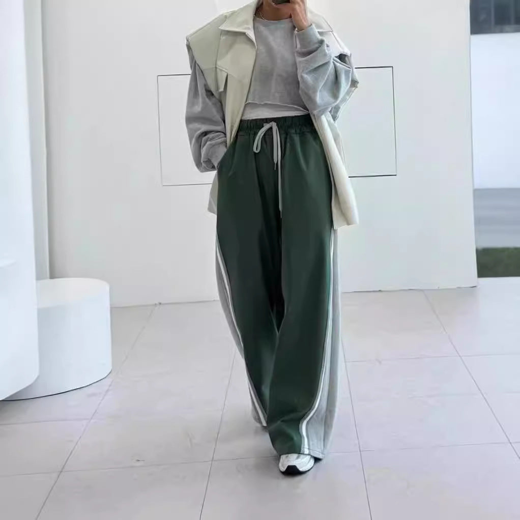 Unisex weite zweifarbige Jogginghose mit Seitenstreifen und Tunnelzug Shop Nory