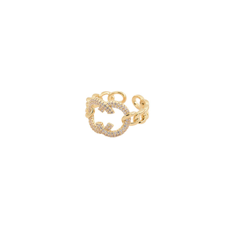 Damenring mit funkelndem Zirkonia-Element und modernen Gliederdetails Shop Nory