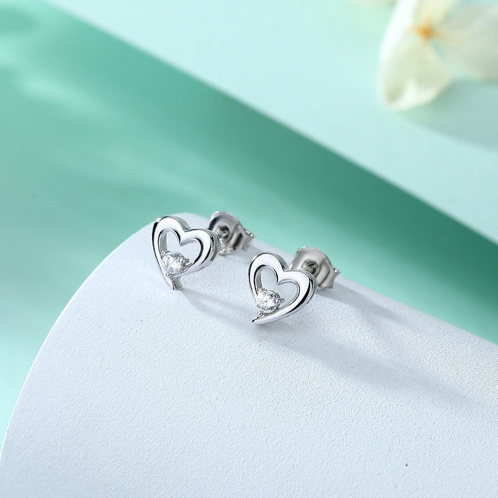 Damen Ohrringe im Herzdesign mit funkelnden Zirkonia Shop Nory