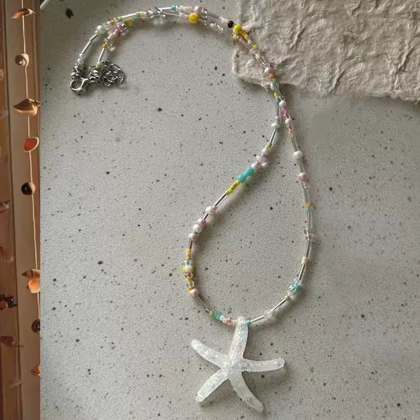 Damen Kette mit verspieltem Sternenanhänger und bunten Perlen Shop Nory