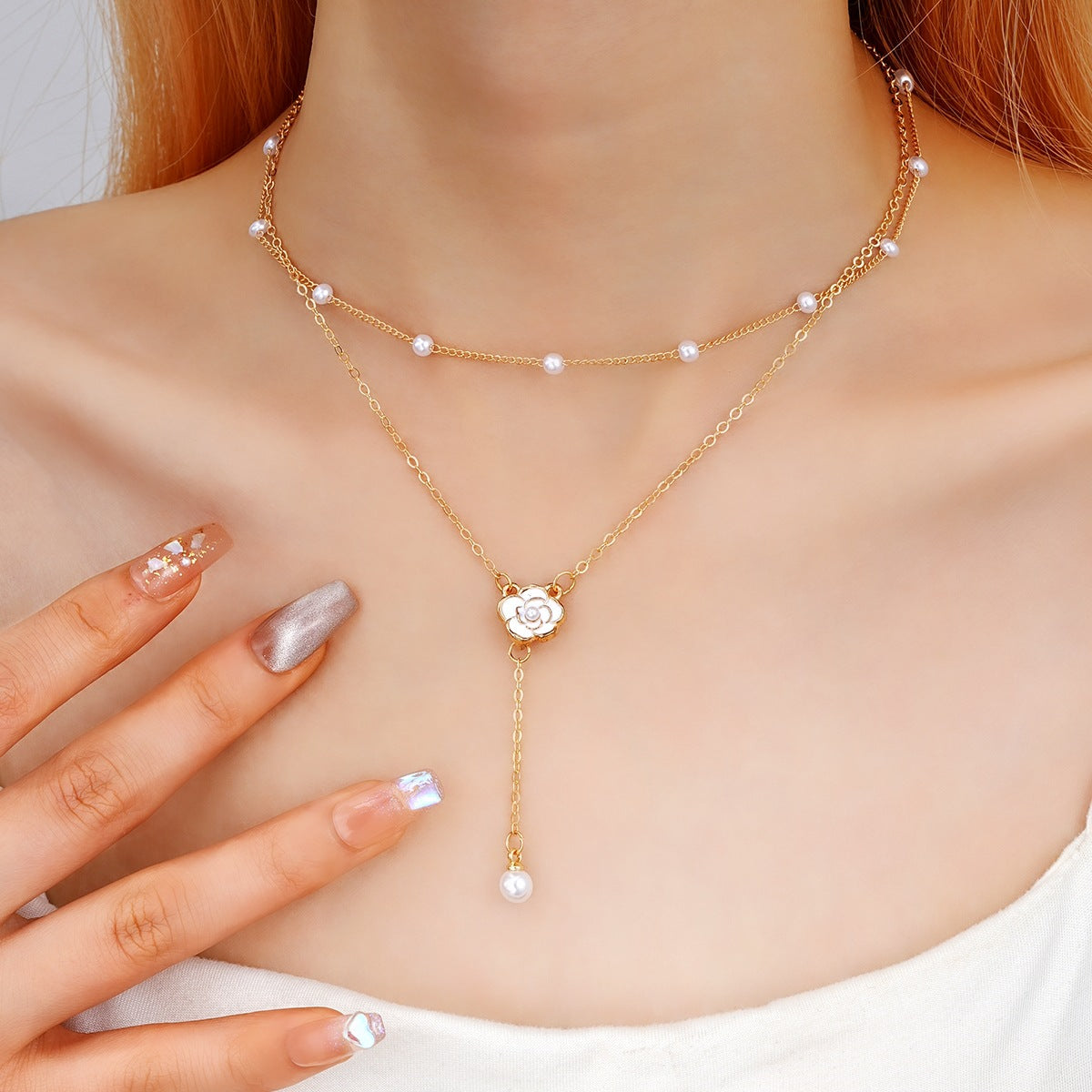 Damen Halskette mit eleganten Perlen- und Blumenakzenten Shop Nory