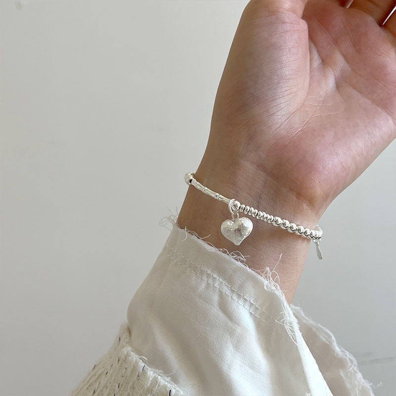 Damen Armband mit herzförmigem Anhänger Shop Nory