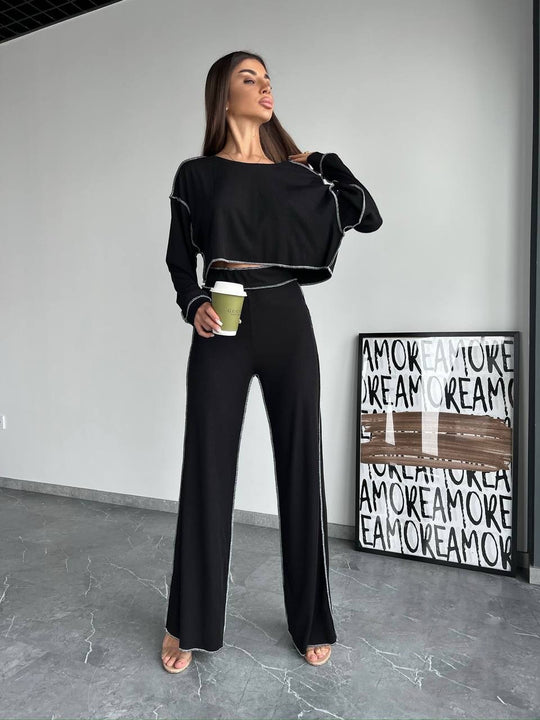 Damen Cropped Oversized-Sweatshirt mit Overlocknähten und High-Waist ausgestellter Hose Set Shop Nory