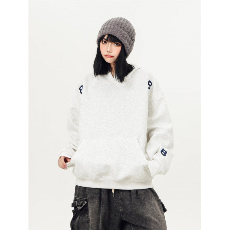 Unisex Oversized Kapuzenpullover mit großflächigem Intarsien‑Blockprint und geripptem Saum Shop Nory