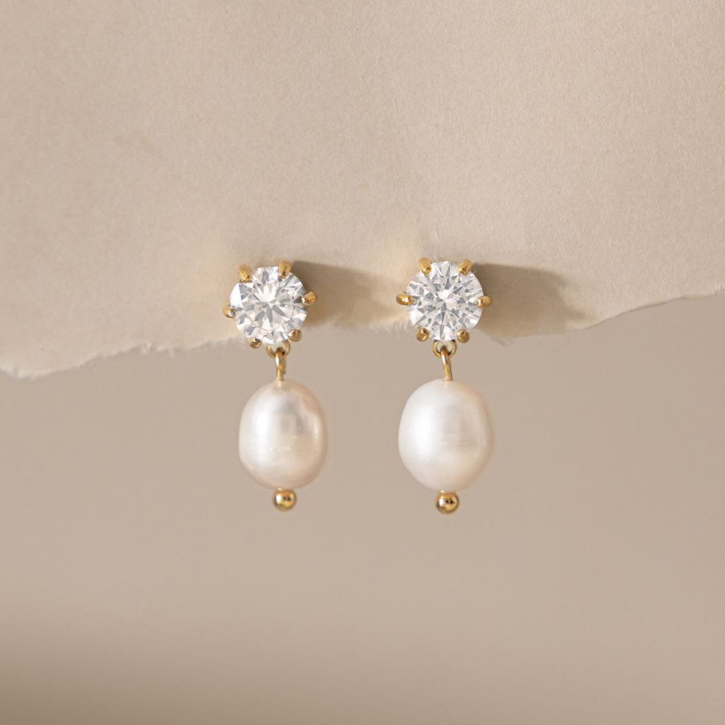 Damen Ohrhänger mit funkelnden Zirkonia und elegantem Perlenanhänger Shop Nory