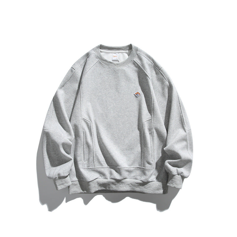 Unisex Oversize-Sweatshirt aus French-Terry mit Raglanärmeln, verdeckten Eingrifftaschen und kleinem Logopatch Shop Nory
