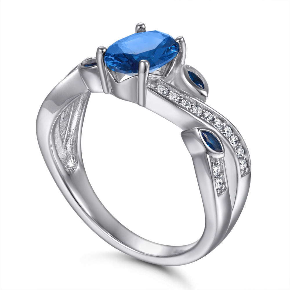 Damenring mit elegantem, geschwungenem Design und funkelnden Zirkoniasteinen Shop Nory