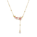 Damen filigrane Halskette mit floralen Anhängern und eleganter Perlenverzierung Shop Nory