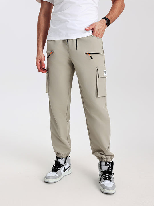 Herren konisch geschnittene Utility-Cargohose im Joggerstil mit Tunnelzugbund, Reißverschlusstaschen & elastischen Beinabschlüssen Shop Nory