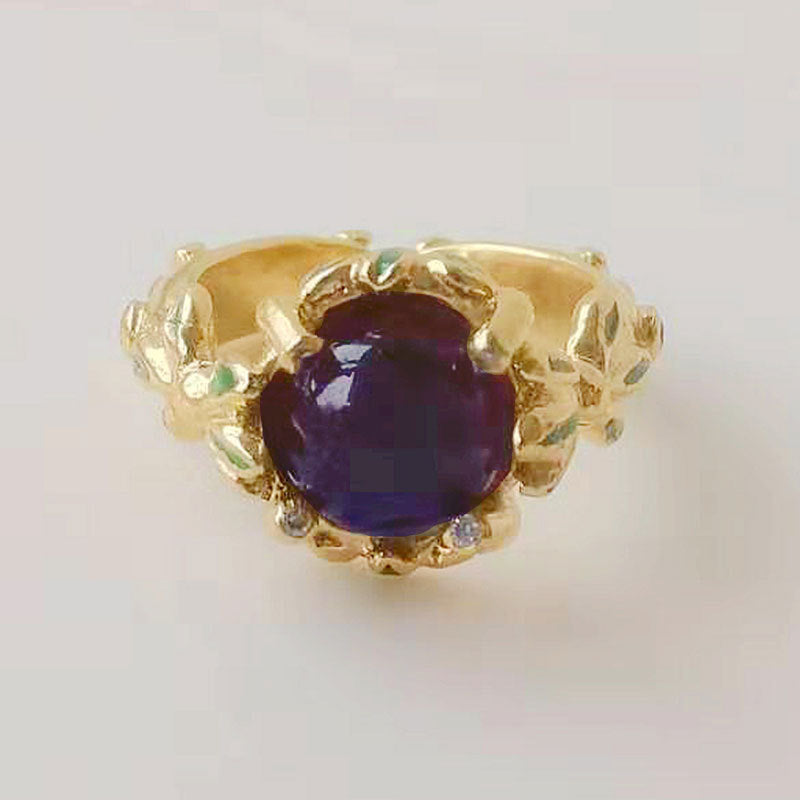 Damenring mit kunstvollem Blumendesign und violettem Edelstein Shop Nory