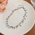 Damen Kette mit verspieltem Design aus bunten Kristallen und charmanten Anhängern Shop Nory