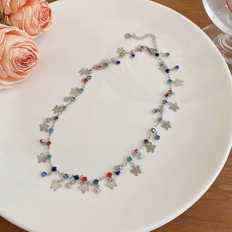 Damen Kette mit verspieltem Design aus bunten Kristallen und charmanten Anhängern Shop Nory