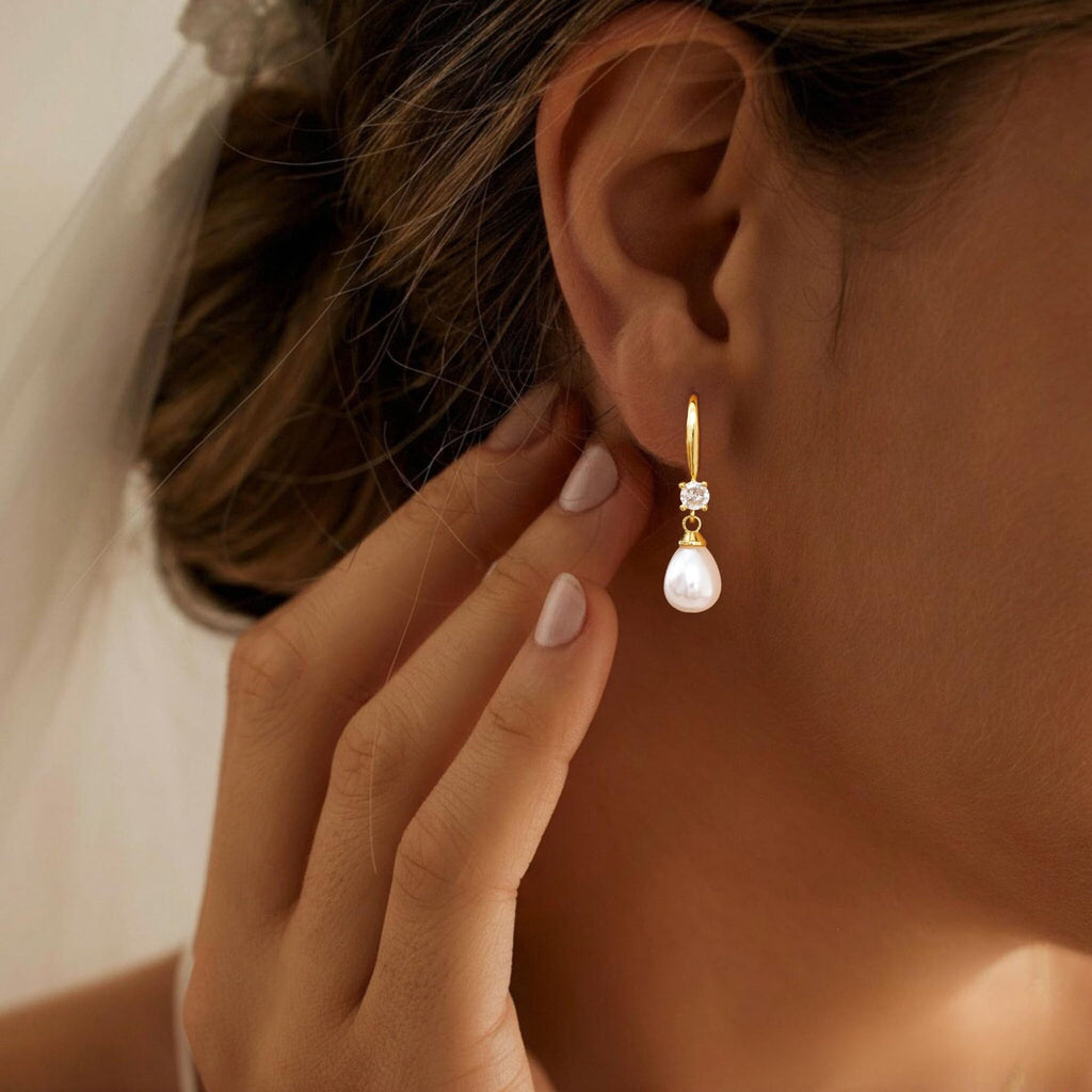 Damen Ohrhänger mit funkelndem Zirkonia und eleganter Perlenverzierung Shop Nory