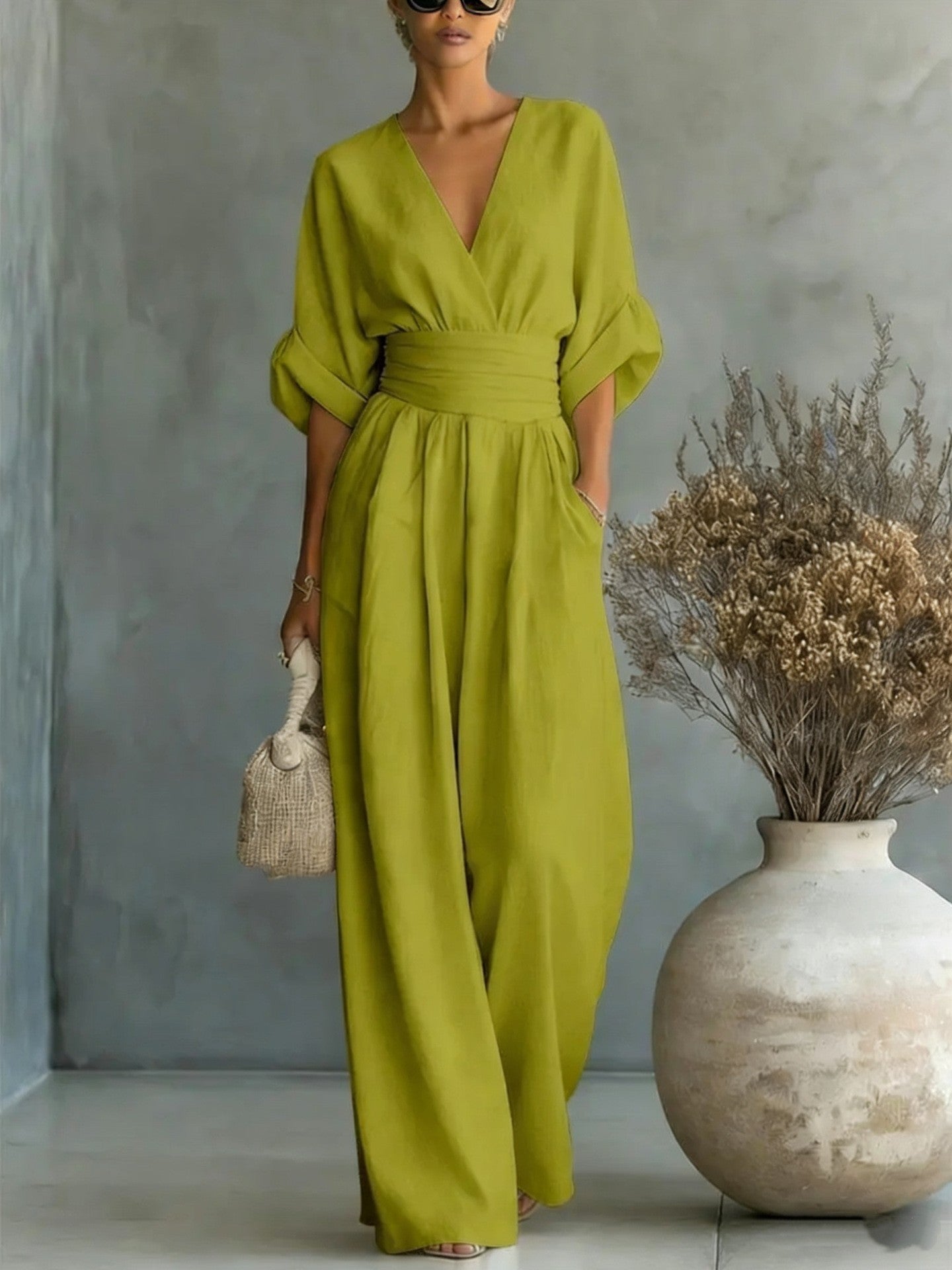Eleganter Ärmelloser Jumpsuit mit Tiefem V-Ausschnitt, Taillenbund und Weitem Bein