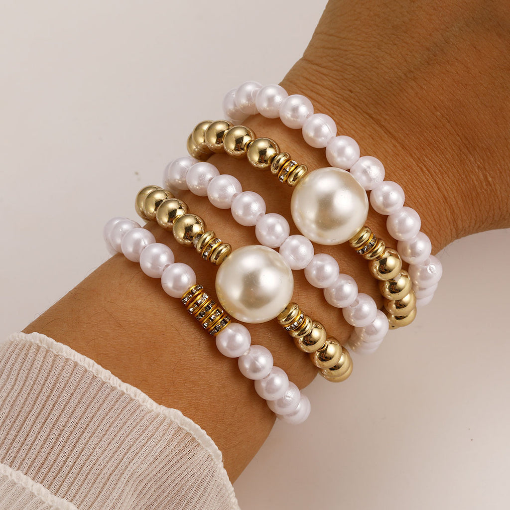 Damen Perlenarmband mit eleganten goldenen Akzenten Shop Nory