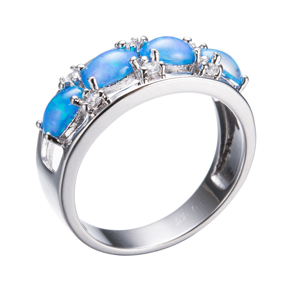Damen Ring mit leuchtenden Opalsteinen und funkelnden Zirkonia-Elementen Shop Nory