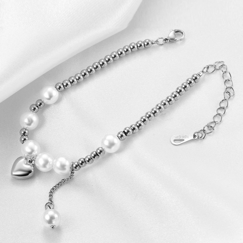Damen Armband mit Herzanhänger und Perlenakzenten Shop Nory