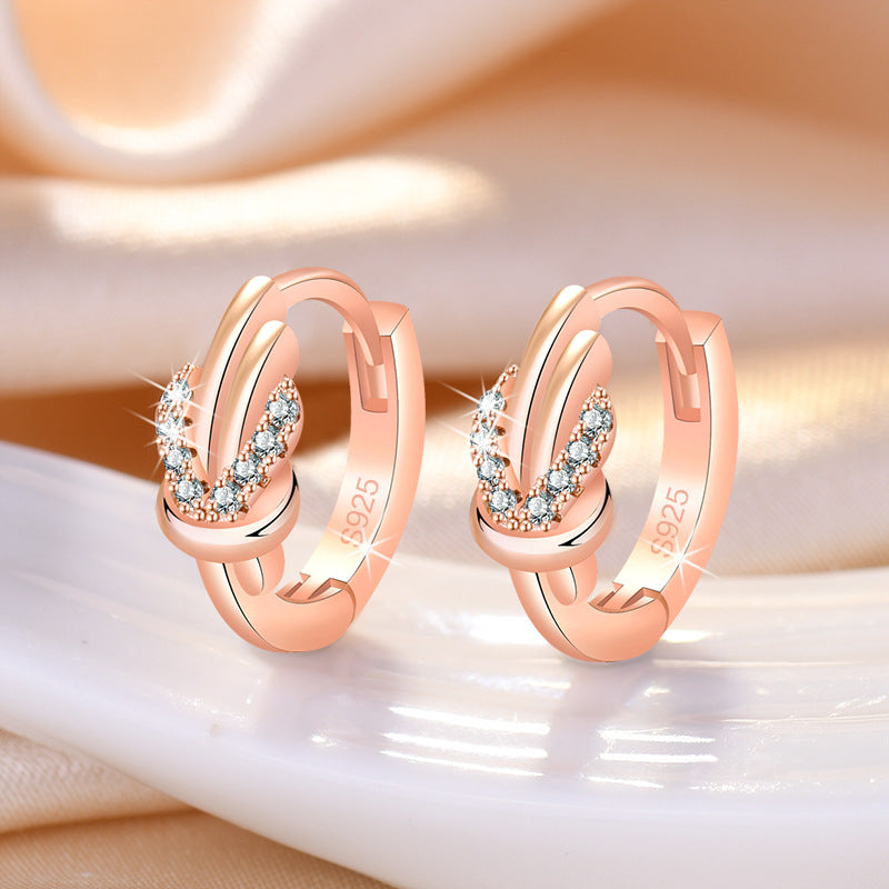 Damen Ohrringe mit elegantem Knoten-Design und funkelndem Zirkonia-Besatz Shop Nory