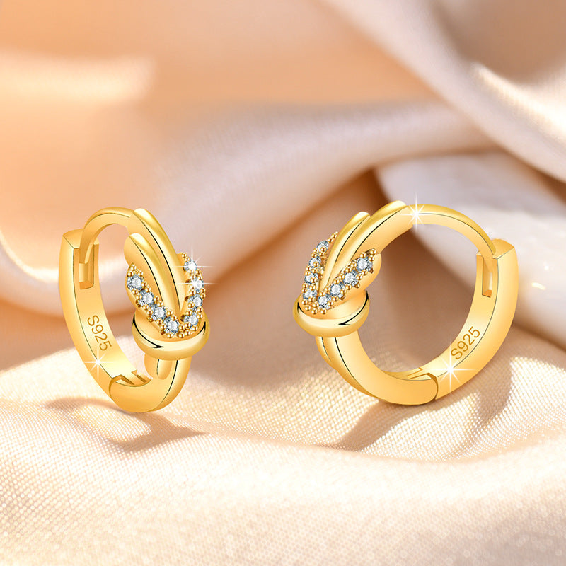 Damen Ohrringe mit elegantem Knoten-Design und funkelndem Zirkonia-Besatz Shop Nory