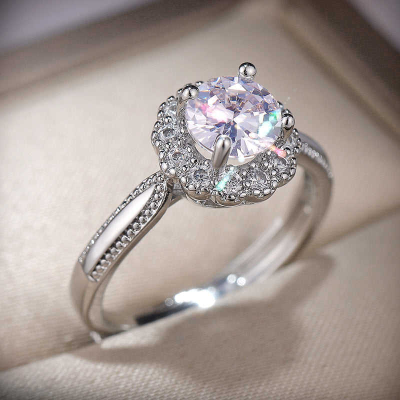 Damen zierlicher Ring mit strahlendem Hauptstein und filigranen Akzenten Shop Nory