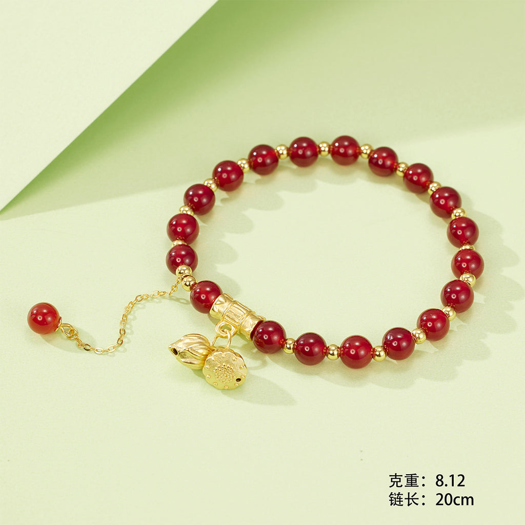 Damen Armband mit kunstvollen Anhängern und eleganten Perlenelementen Shop Nory