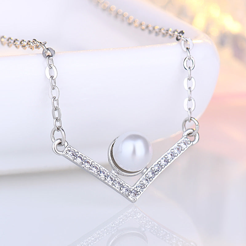 Damen Halskette aus hochwertigem Edelstahl mit eleganter Perle und funkelnden Zirkonia-Elementen Shop Nory