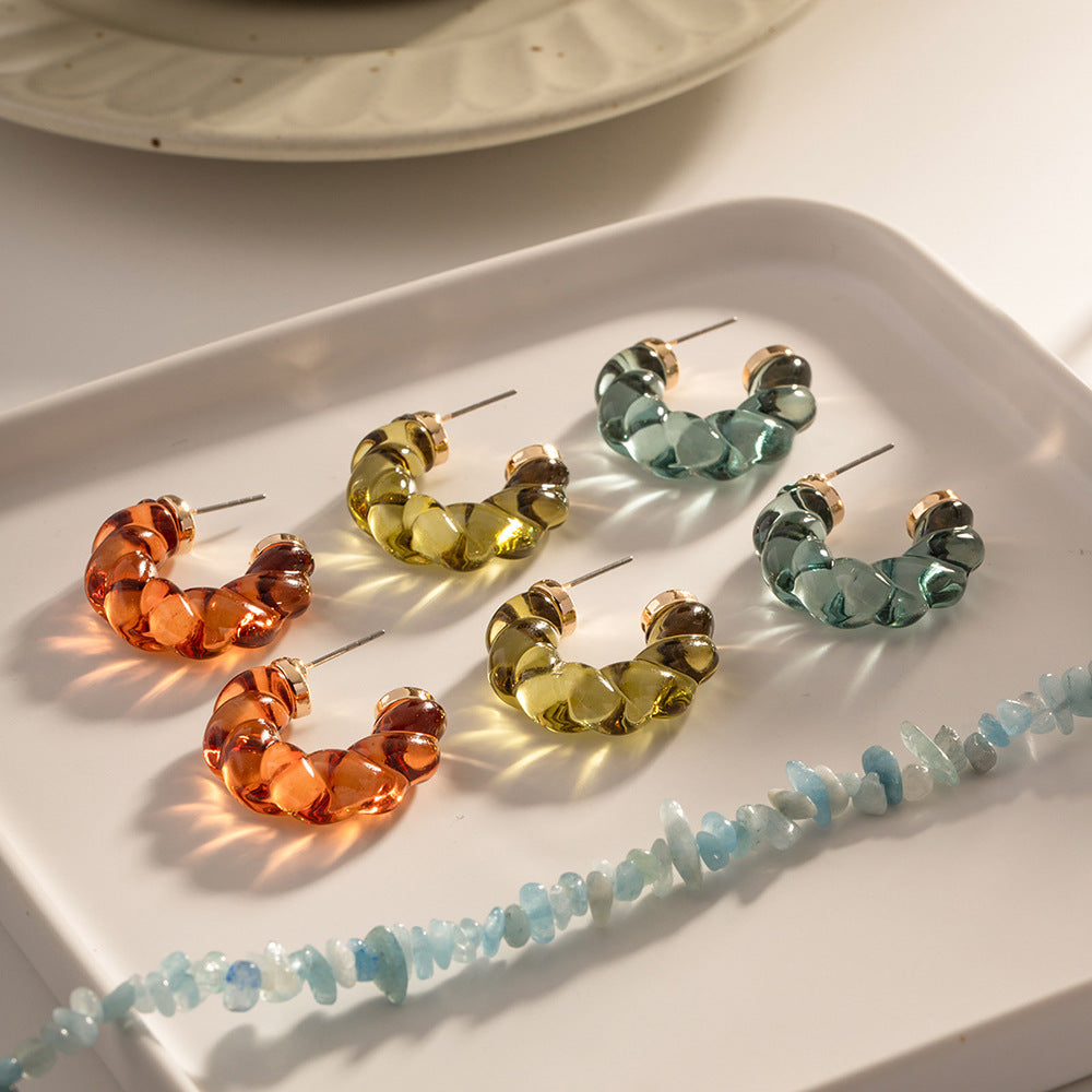 Damen Creolen aus leuchtendem Kunstharz mit elegantem Twist-Design Shop Nory