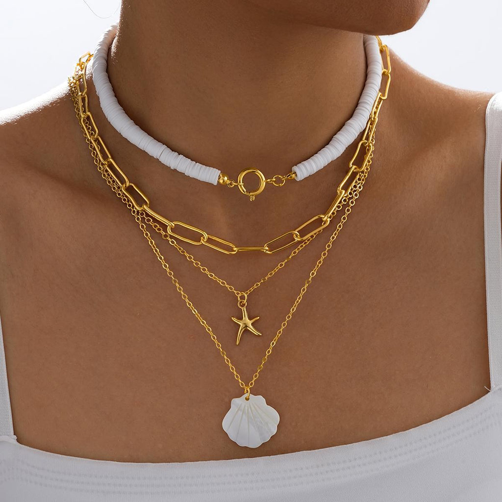 Damen mehrschichtige Halskette mit stilvollen Muschel-Anhängern und goldenen Ketten Shop Nory