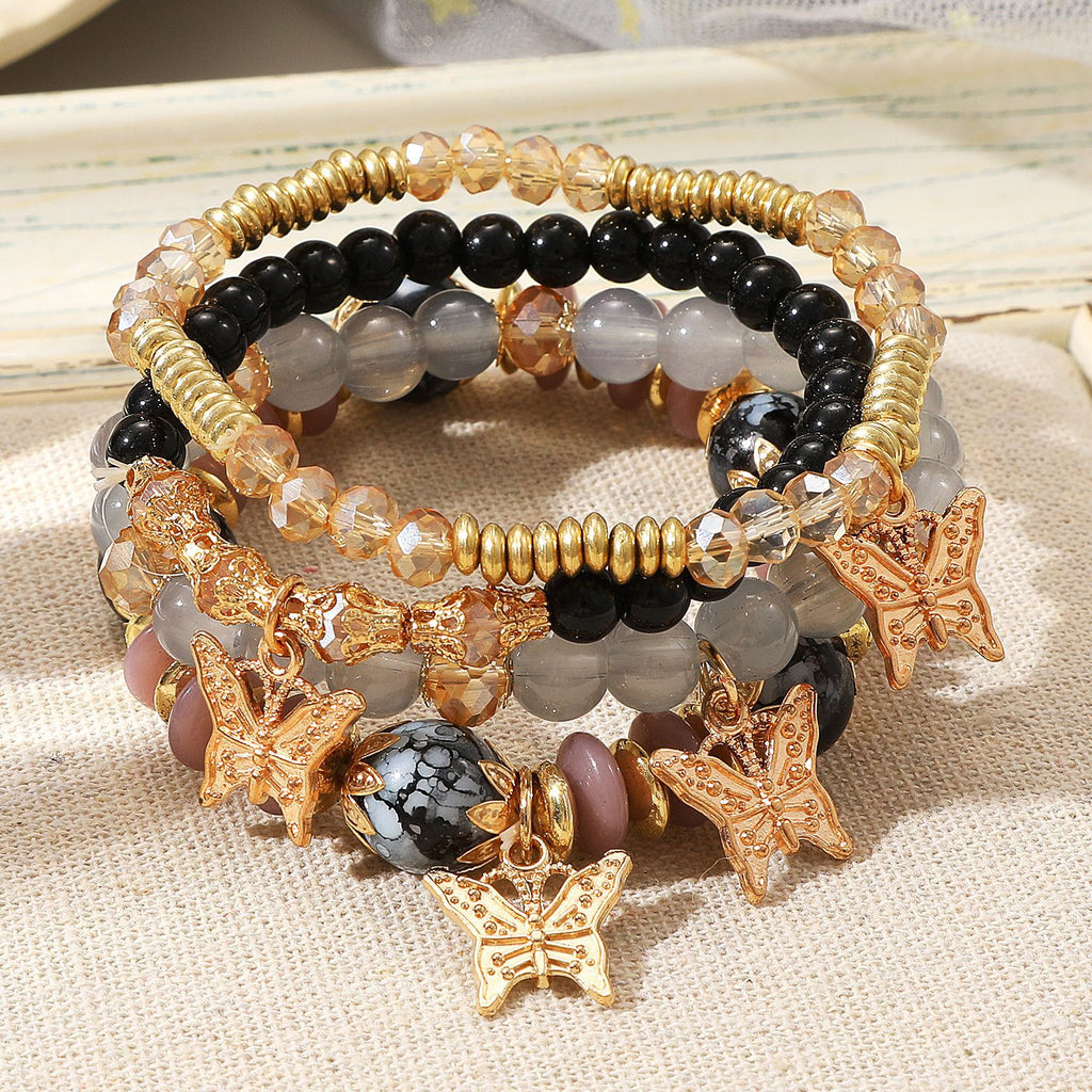 Damen Armband-Set mit filigranen Schmetterlingsanhängern und funkelnden Akzenten Shop Nory