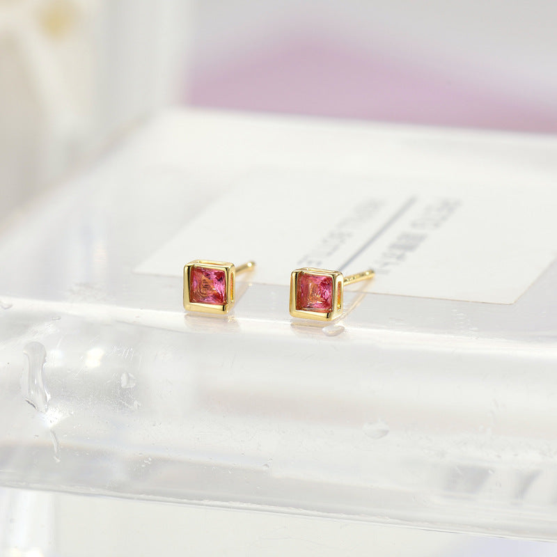 Damen Ohrstecker mit quadratischem, funkelndem Stein und elegantem Goldrand Shop Nory